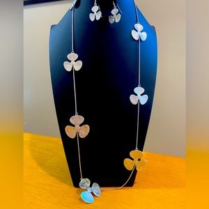 Silver necklace with earrings set. Pinwheel/violet flower design.